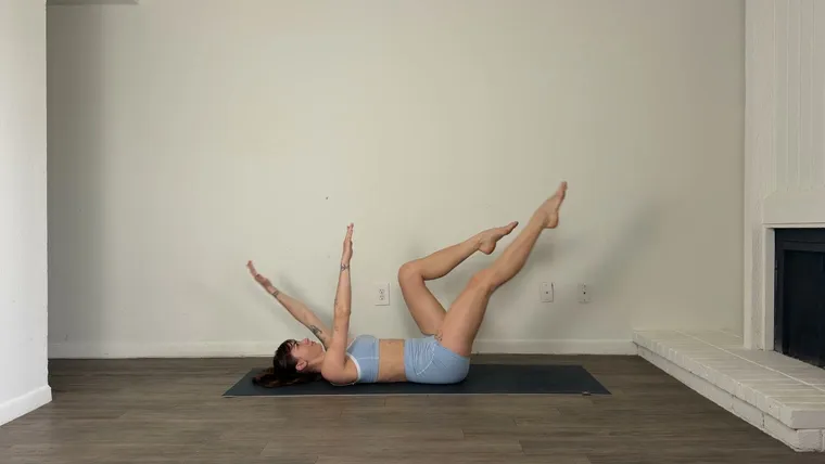 A raw landscape frame of a floor exercise, with the whole body and the mat in shot.