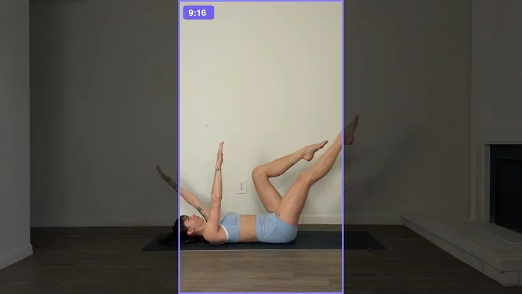 A landscape workout frame with a 9:16 box in the middle. Everything outside the box is dimmed, and one of her arms and one raised foot fall outside it.
